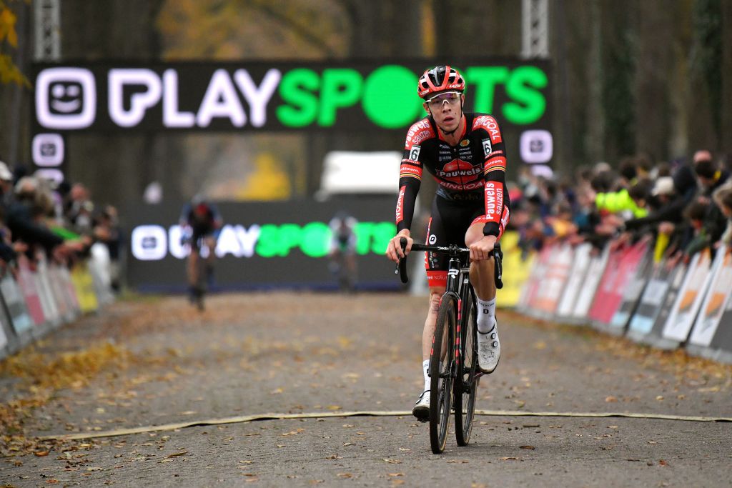 RIJKEVORSEL BELGIUM NOVEMBER 20 Laurens Sweeck of Belgium and Team Pauwels Sauzen Bingoal crosses the finish line in third place during the 35th Superprestige Merksplas 2021 Mens Elite Superprestige2022 SPMerksplas on November 20 2021 in Rijkevorsel Belgium Photo by Luc ClaessenGetty Images