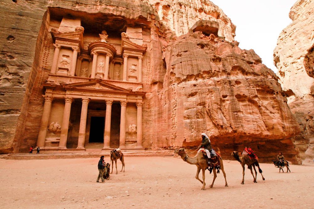 Petra&amp;#039;s Treasury, carved from sandstone cliffs.