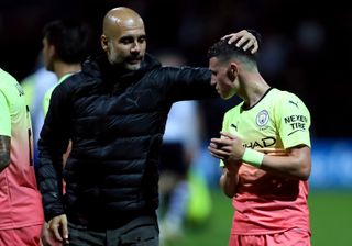 Guardiola (left) demands the best in all competitions