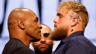 Mike Tyson and Jake Paul stare each other down in the ring