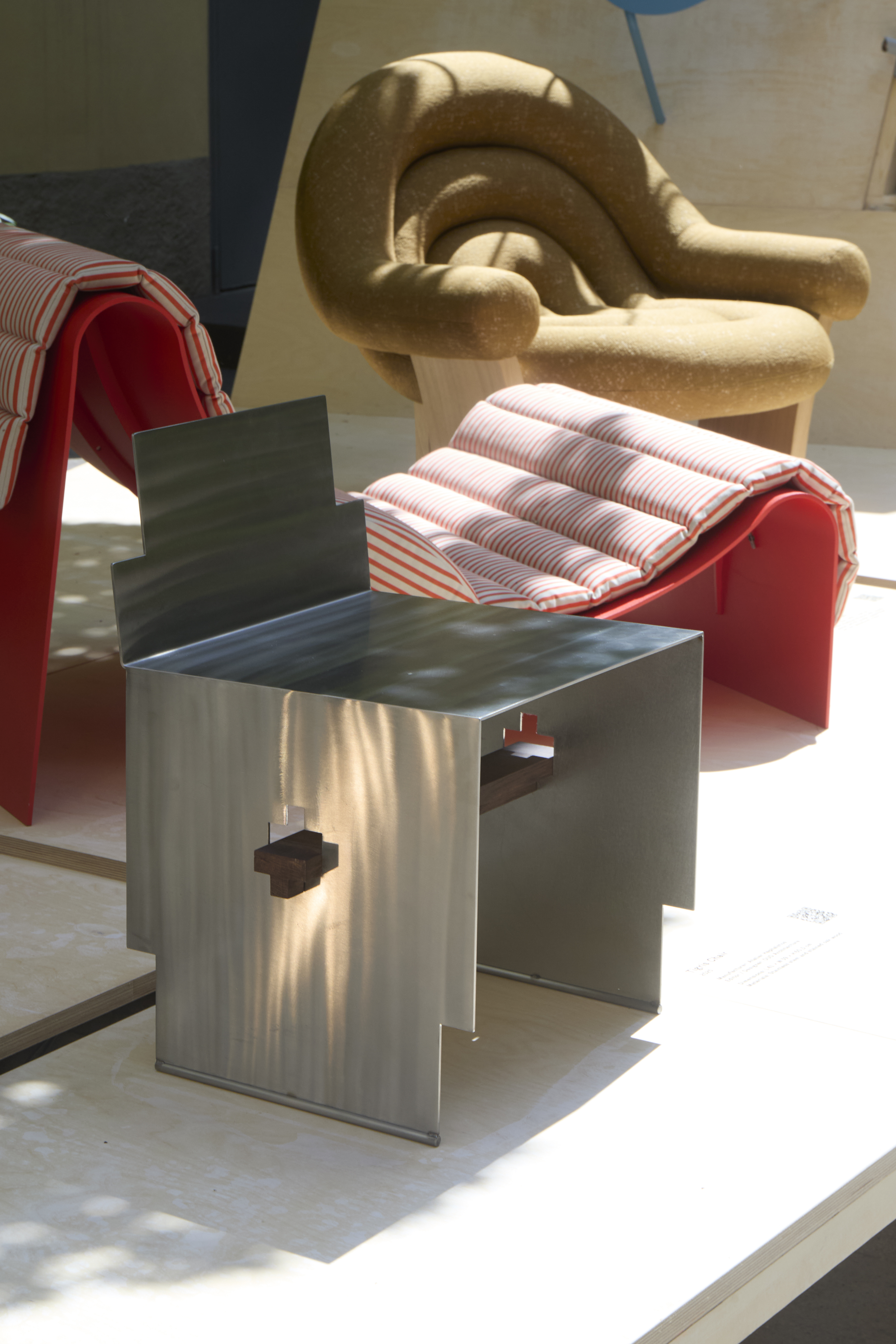 furniture and lighting displayed on timber platform