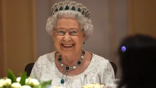 Queen Elizabeth II smiles as she attends a dinner at the Corinthia Palace Hotel in Attard during the Commonwealth Heads of Government Meeting