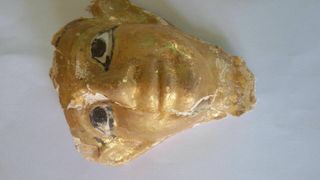 Masks gilded with gold and worn by Egyptian mummies were found in some of the tombs.