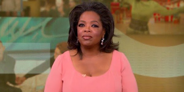 Oprah Winfrey in a pink dress on The Oprah Winfrey Show