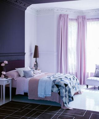 Purple bedroom ideas for teens with a variety of purple hues on the walls, drapes and bed linen.