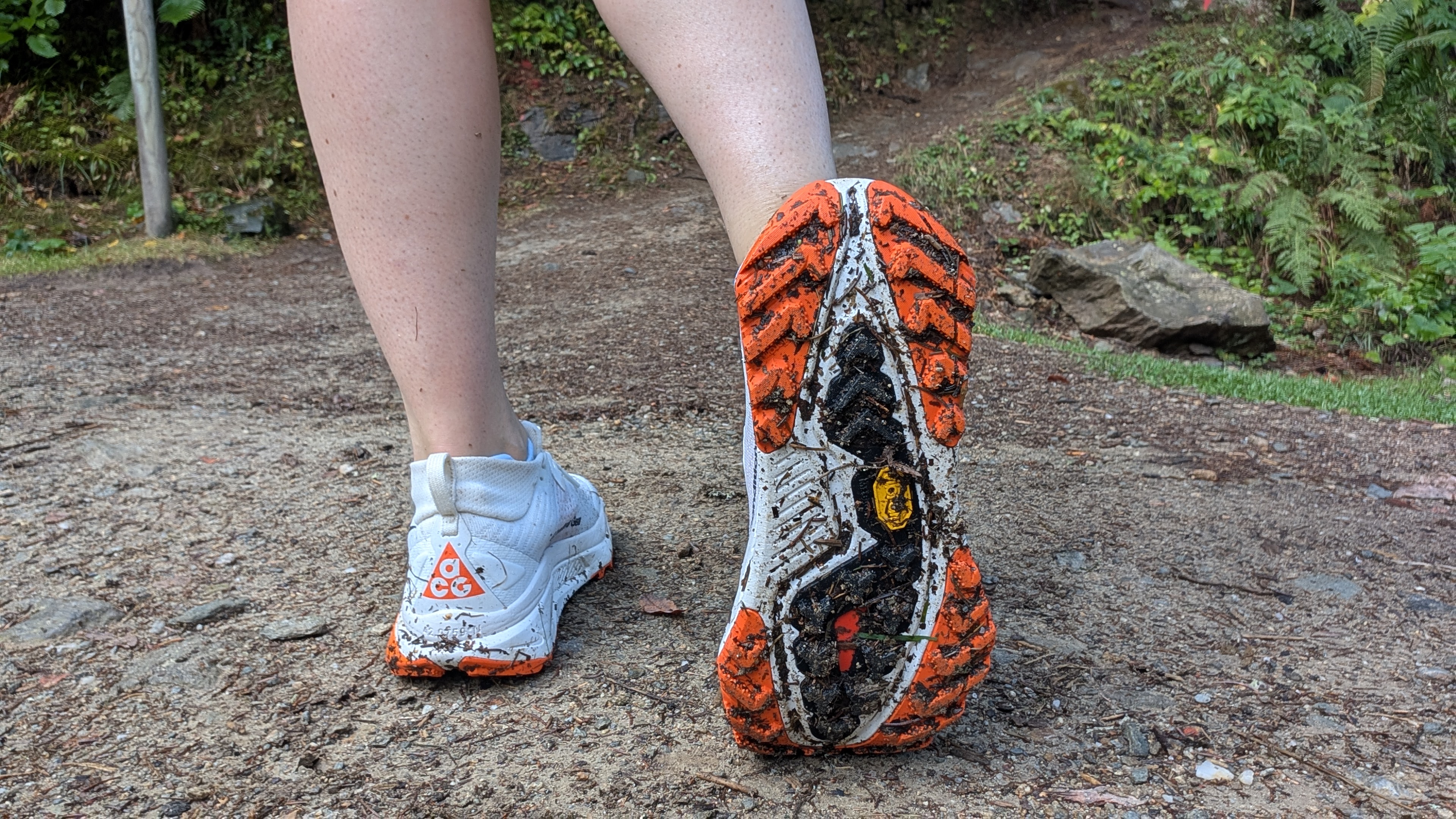 Runner's feet showign the sole of the Nike ACG Zegama Trail shoes on a trail