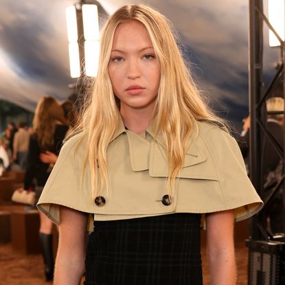 Lila Moss attended the Burberry London Fashion Week show in a cropped trench coat