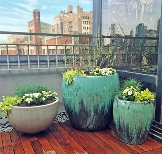 aqua ceramic planters on Brooklyn deck by Amber Freda