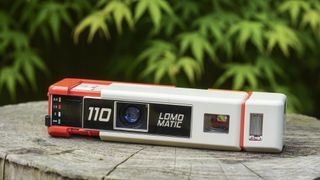 An image of the Lomography Lomomatic 110 film camera extended to reveal the lens