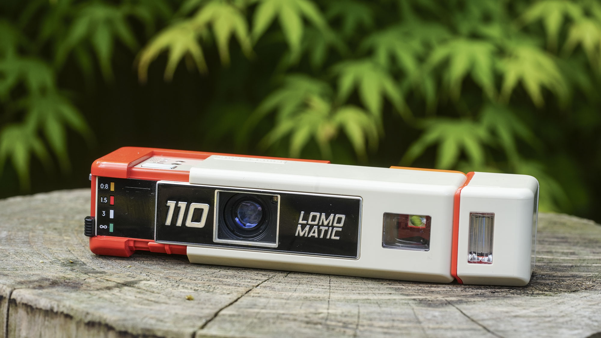 An image of the Lomography Lomomatic 110 film camera extended to reveal the lens