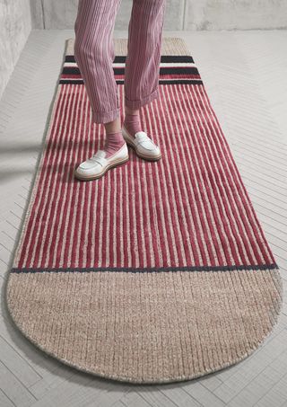 Stripy trousers and stripy rug