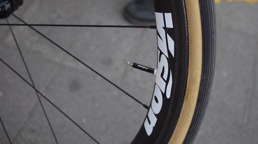 Wheel decals double up to prevent the tyre valves rattling in the rim over the cobbles