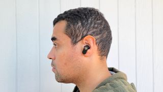 Our reviewer testing the OnePlus Nord Buds' comfort and fit