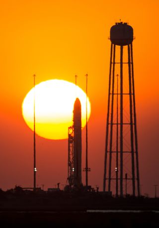 Antares on launch pad at sunrise