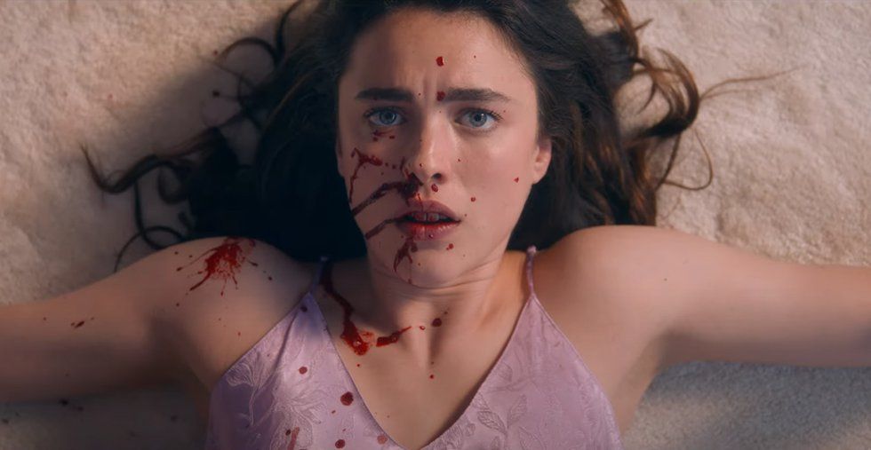 margaret qualley as sue with blood on her face in the substance