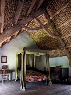 Fig 2: The distinctive scissor truss is one of the original features in this bedroom of about 1610 at Kennixton, a farmhouse from the Gower Peninsula in south Wales. St Fagans National Museum, Cardiff. ©Paul Highnam for Country Life