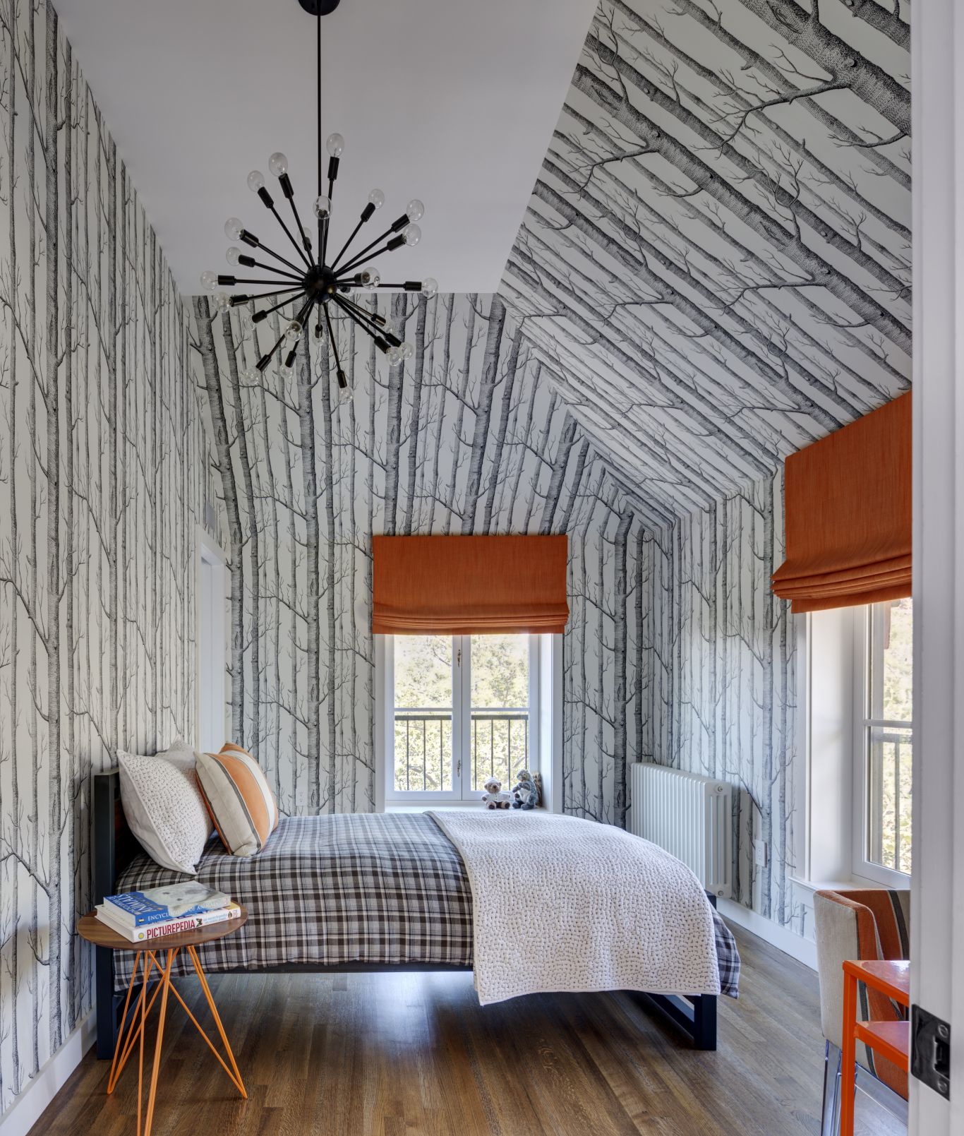 Wallpaper on a slanted ceiling in a bedroom
