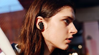 OnePlus Nord Buds review: woman wearing true wireless earbuds
