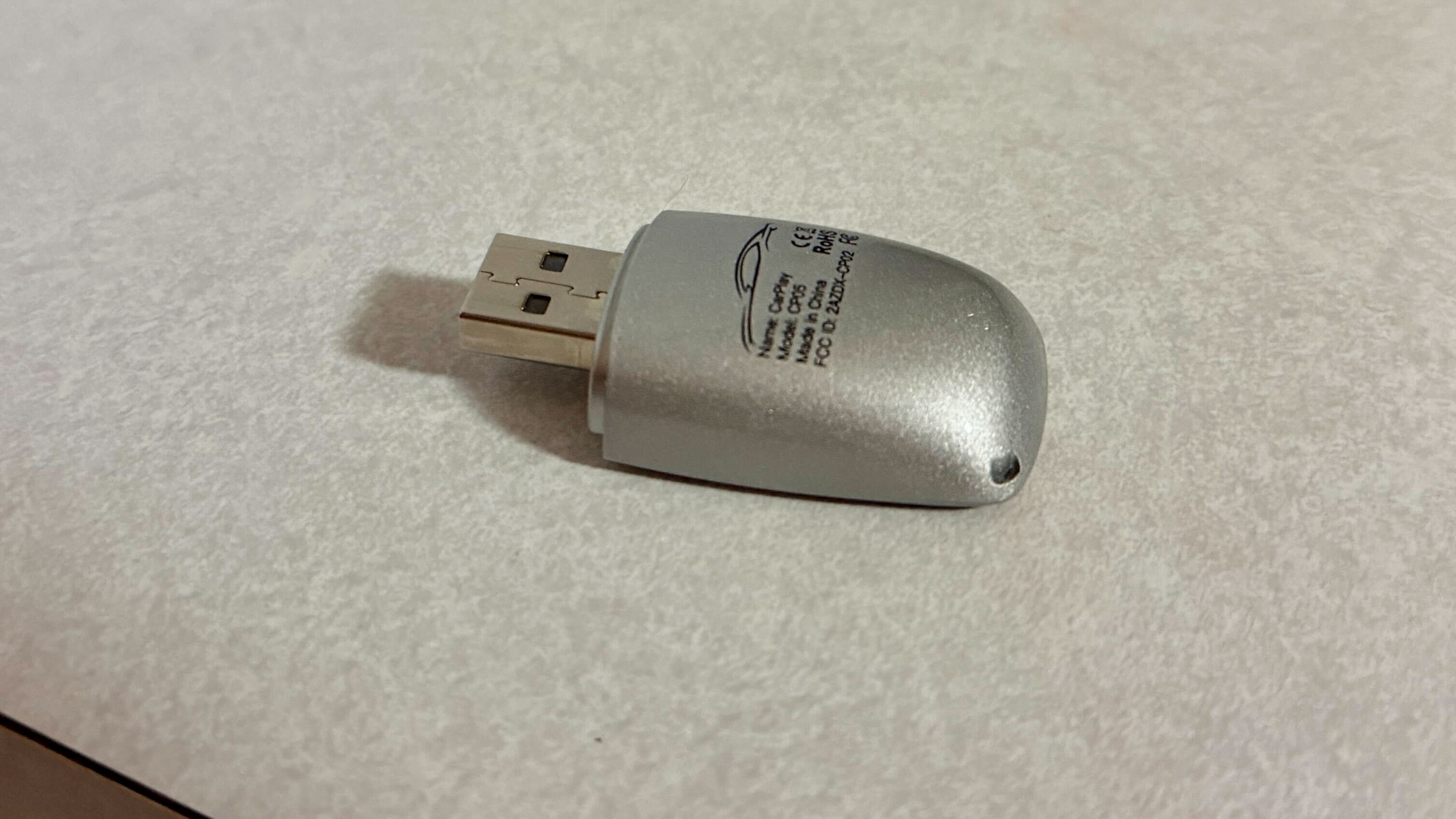 Wireless CarPlay adapter on a counter