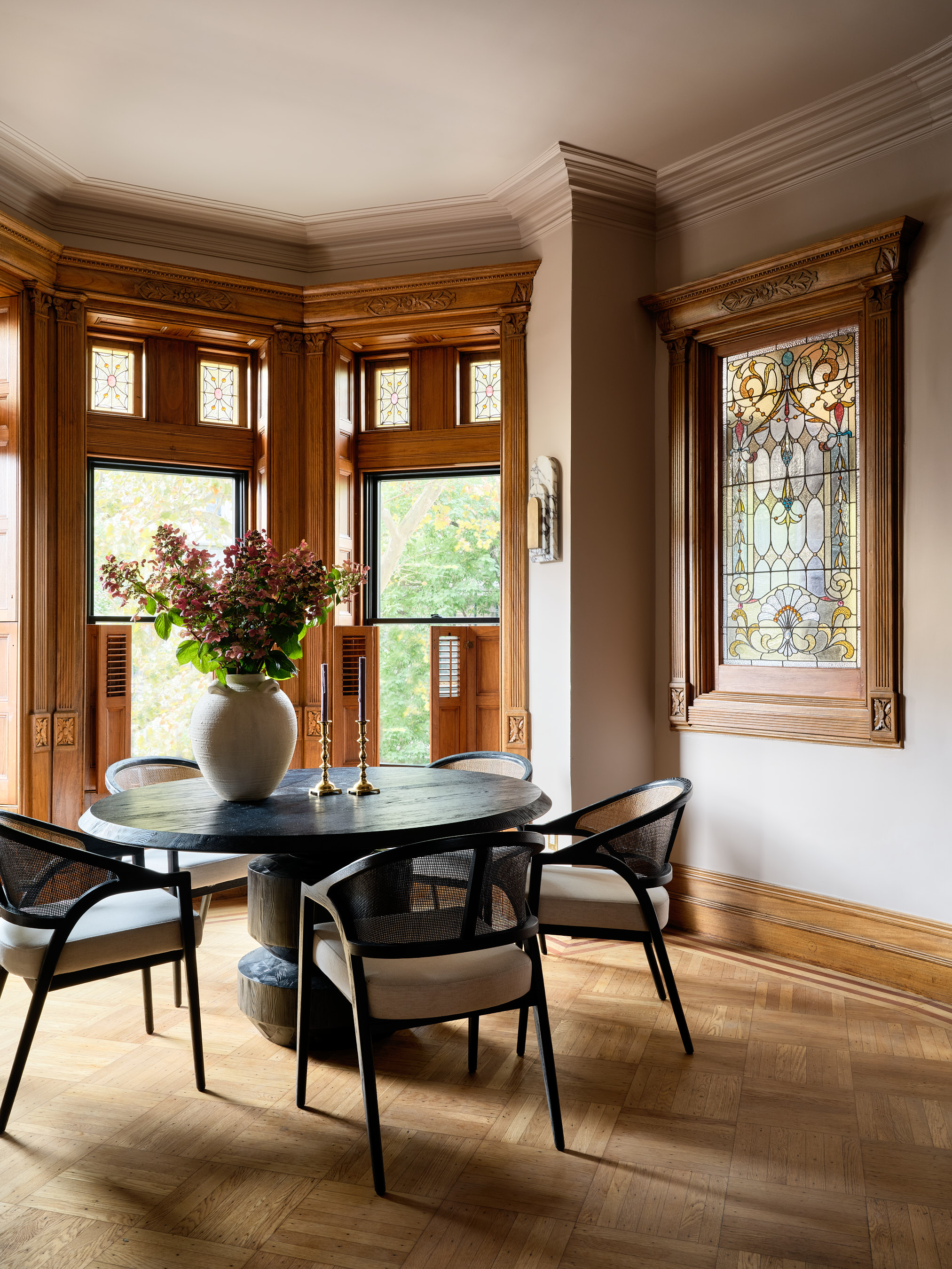 Tudor-style dining room styled with mid-century furniture