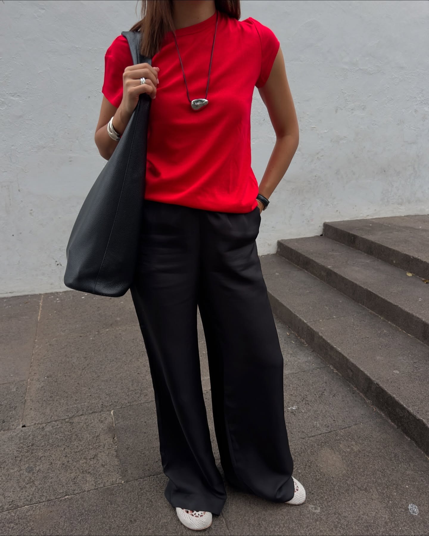 Debora Rosa wearing white crochet flats from Hvoya.