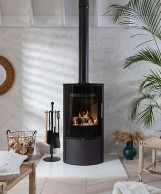 A modern curved log burner in a contemporary scandi room