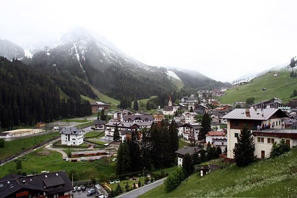 The spectacularly picturesque town of Arabba nestled comfortably at the foot of the Passos Pordoi and Campolongo
