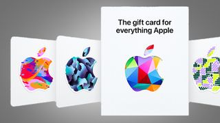 A row of Apple gift cards on a grey background