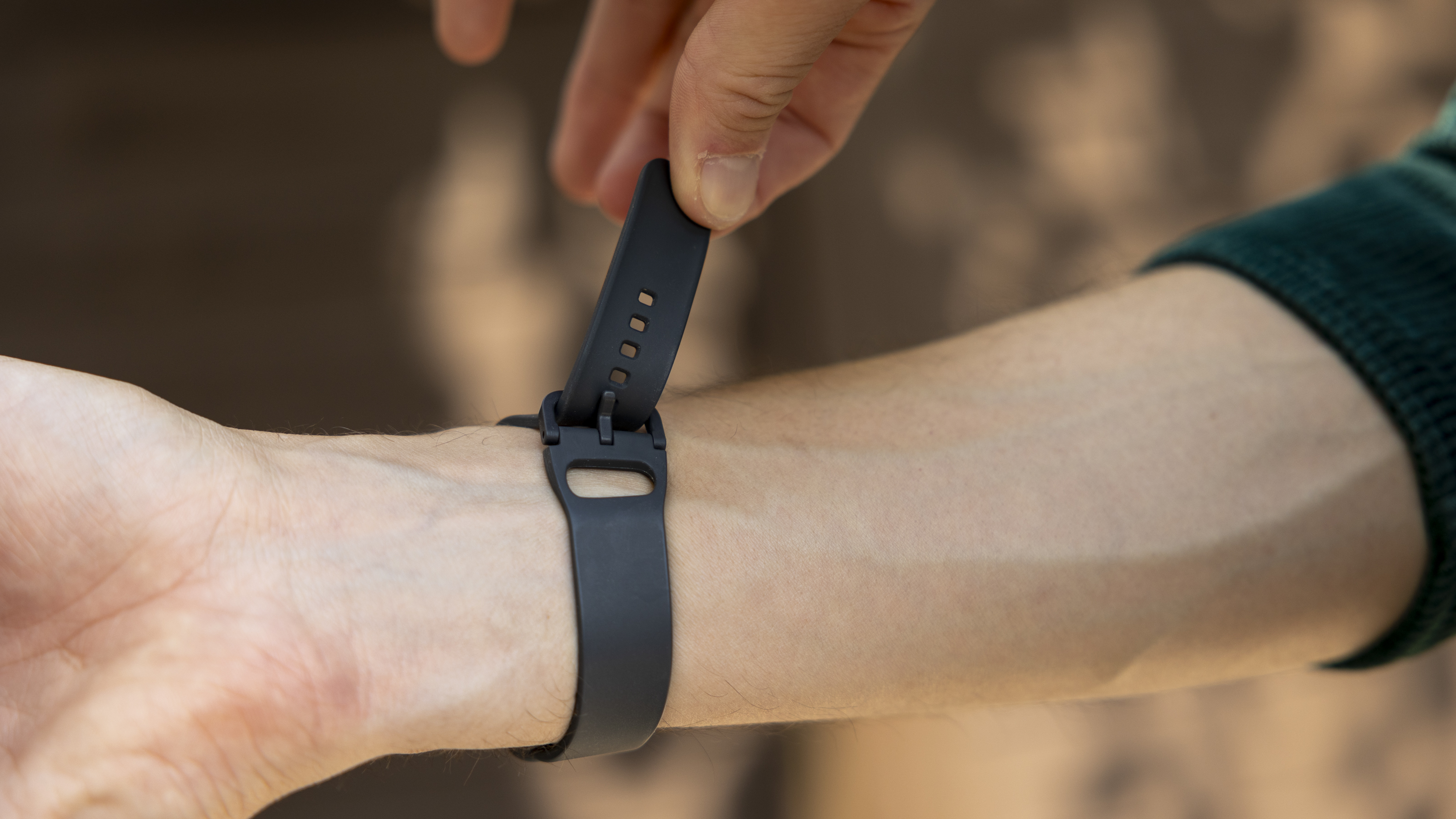 The Samsung Galaxy Fit 3 watch in grey worn on a female wrist