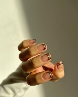 Gold nail polish design.