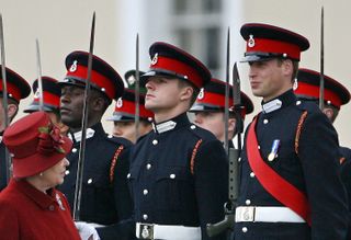 Kate Middleton wears a bright red coat to attend Prince William's pass out parade at Sandhurst on December 15, 2006