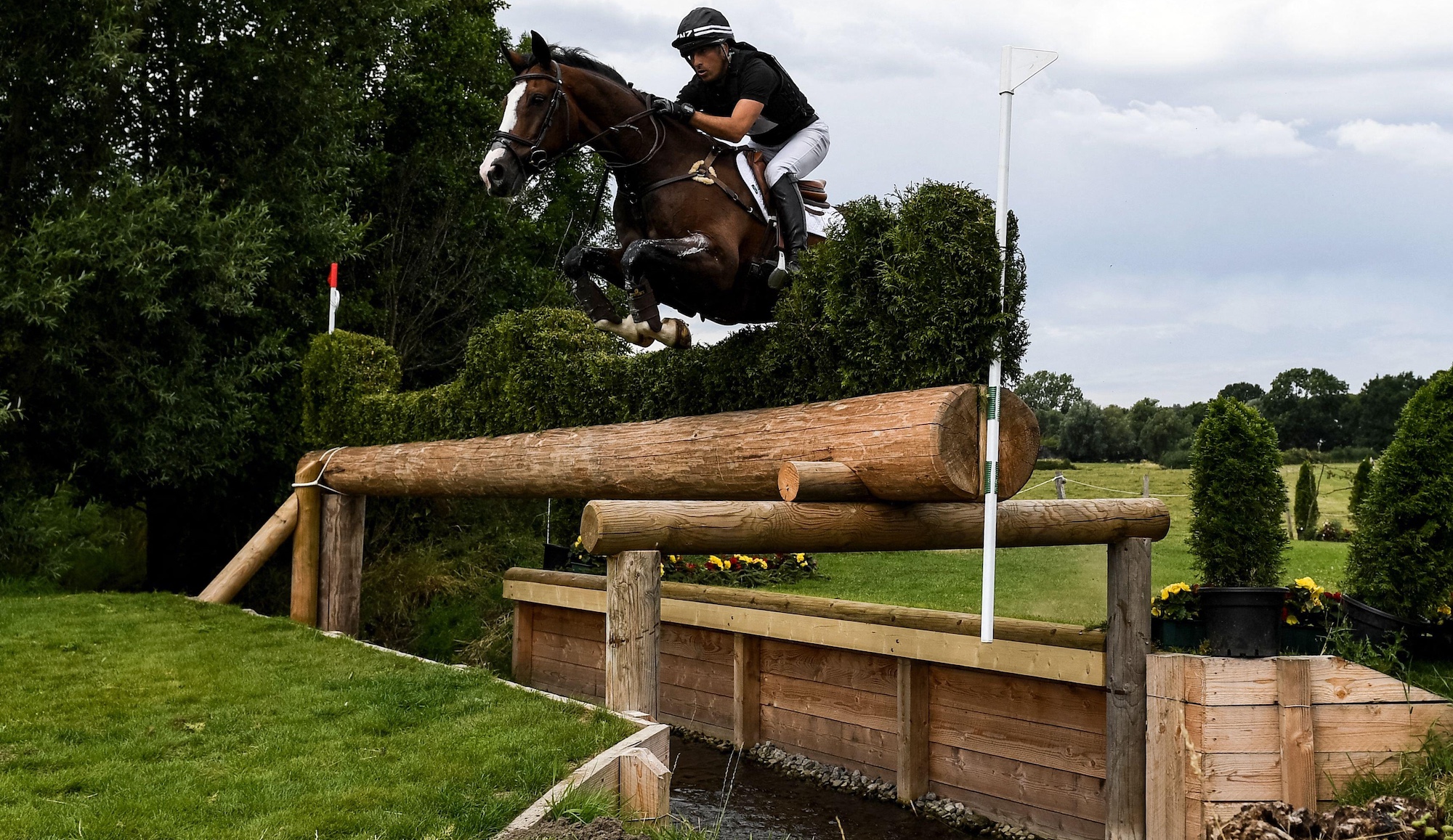 Tim Price jumping a trakehner fence on horse: How to solve your horse&amp;rsquo;s fear of ditches