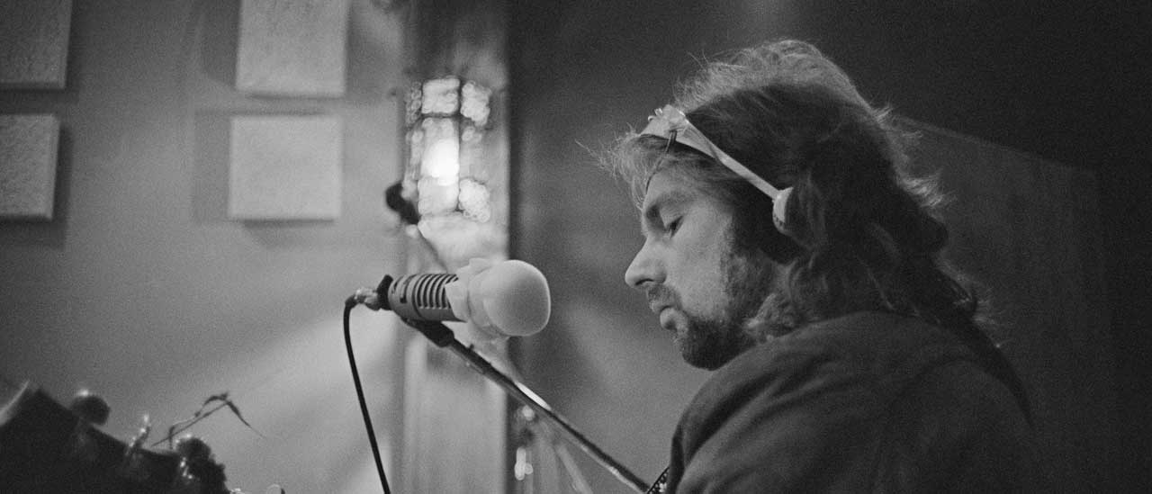 Van Morrison in the studio playing guitar