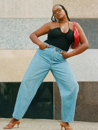 @champagnemani wearing barrel-leg jeans