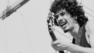 Mexican-born American musician Carlos Santana (right) and American bassist David Brown perform with the other members of Santana at 'Woodstock,' a large rock and roll music concert, Bethel, New York, August 16, 1969.