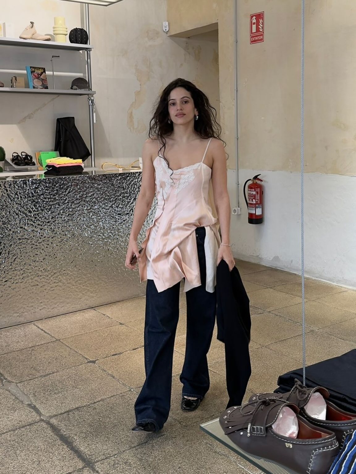 Spanish woman wearing an asymmetric top, a summer 2026 trend.