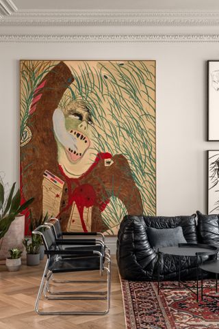A living room with a larger than life painting