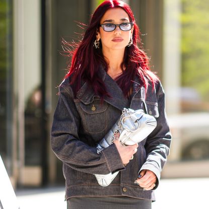 Dua Lipa carries a silver bag while out in new york city