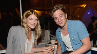Emma Greenwell (L) and actor Jeremy Allen White attend Warby Parker's store opening in The Standard, Hollywood on August 15, 2013 in Los Angeles, California