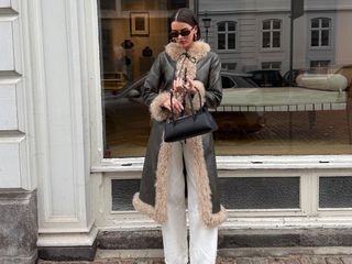 @maryljean wearing a Charlotte Simone fur-trimmed coat.