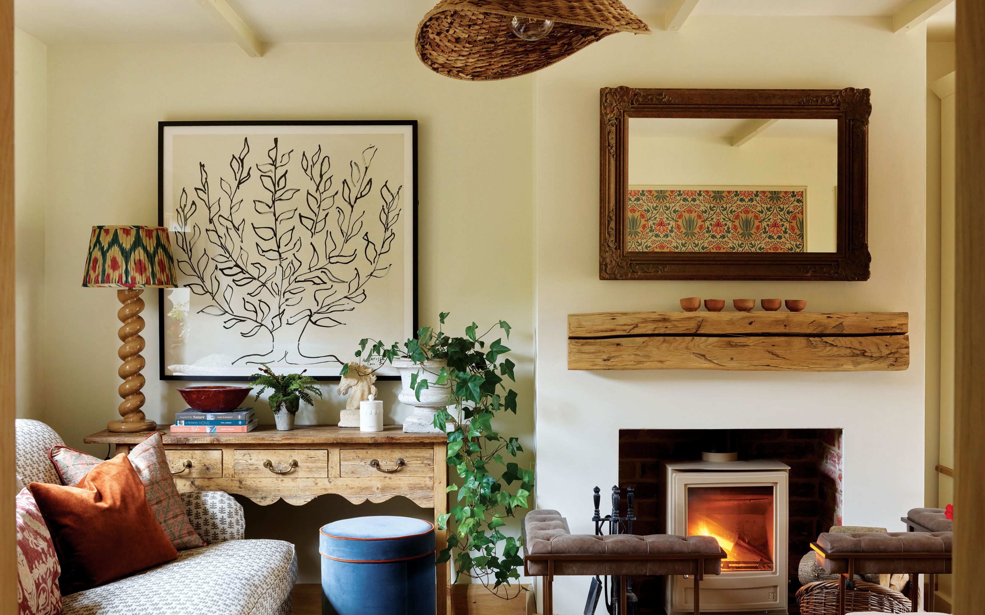 Cozy living room with cream walls and wooden accents and fireplace