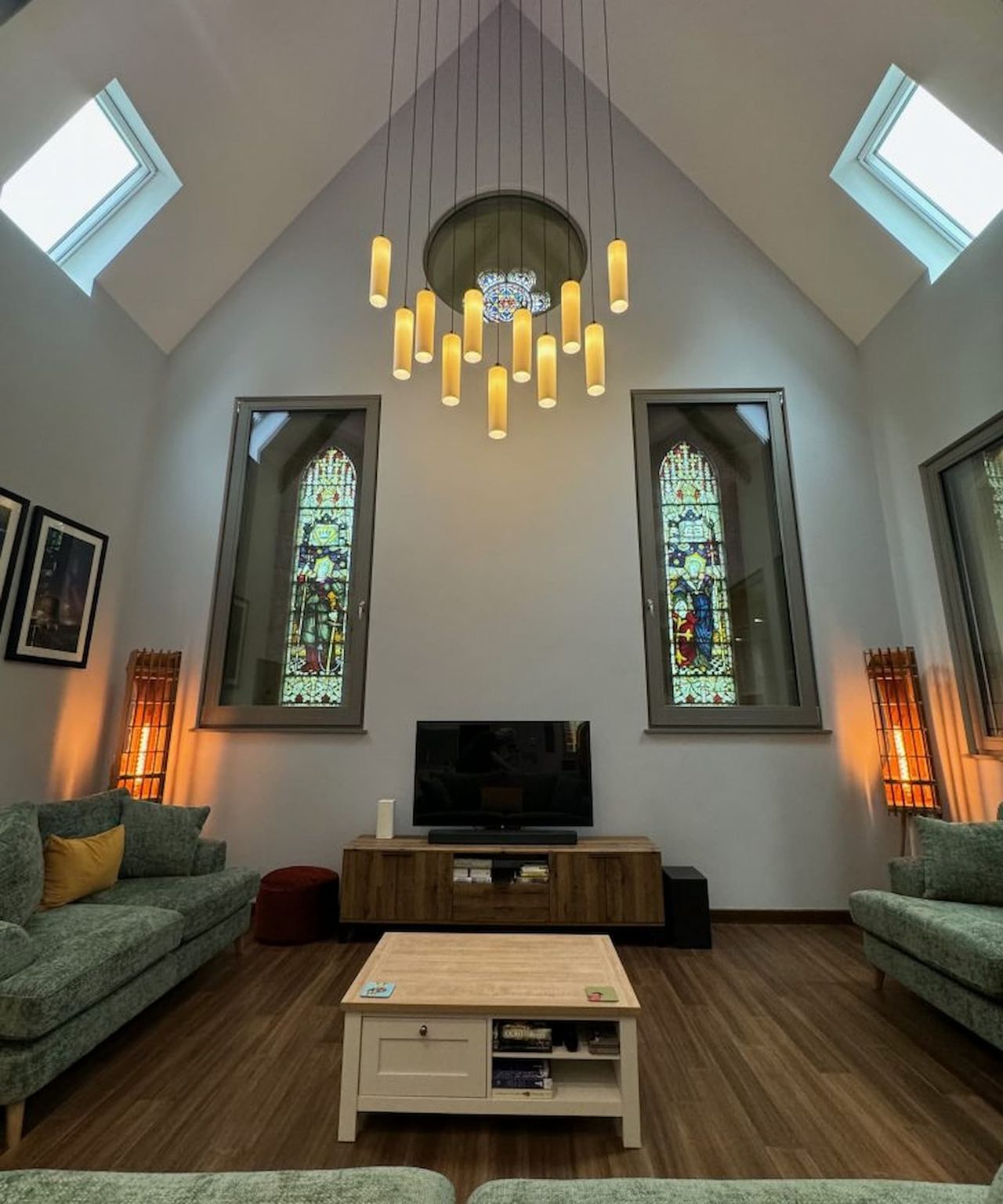 A triangular ceiling and stained glass windows in a living room