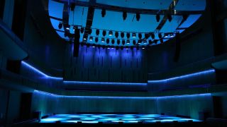 The Holland Center in Omaha alit in blue and red by Ayrton lighting solutions.
