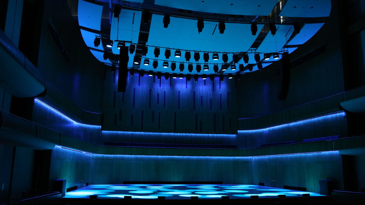 The Holland Center in Omaha alit in blue and red by Ayrton lighting solutions. 