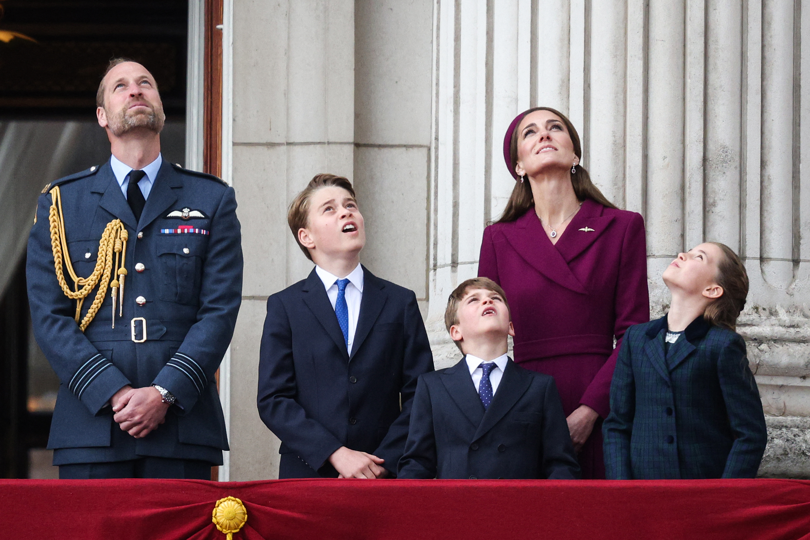 Prince William, Prince George, Prince Louis, Princess Charlotte and Princess Kate looking up at a military flypast on May 5, 2025 for VE Day