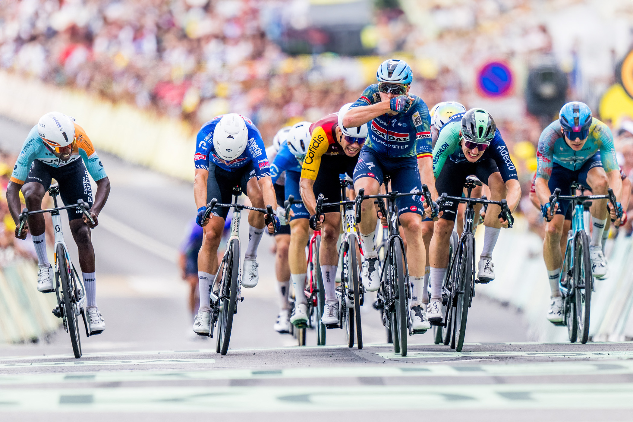 Biniam Girmay, Jasper Philipsen, TIm Merlier, Olav Kooij, and Max Kanter race to the line at the finish of stage 12 of the 2026 Tour de France