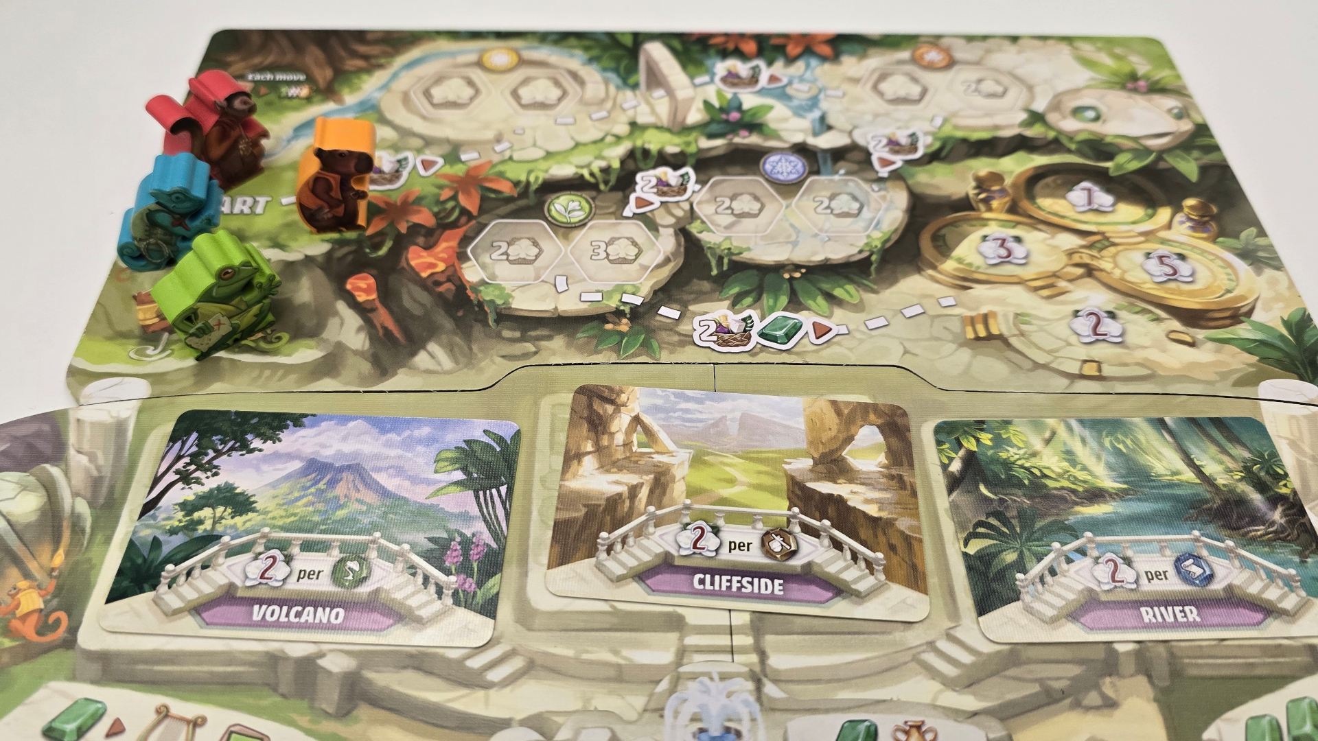 Emerland tokens and cards on the flat version of the ruins board