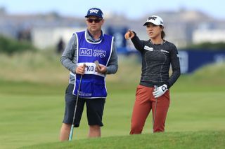 Lydia Ko and her caddie in discussion at the 2020 Women's Open