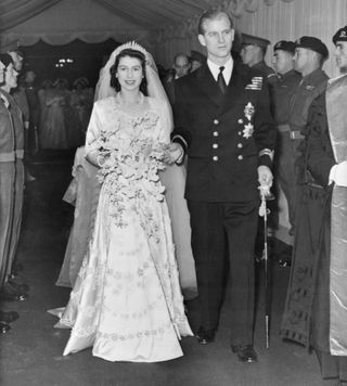 Princess Elizabeth and Prince Philip just married walking down the aisle of Westminster Abbey