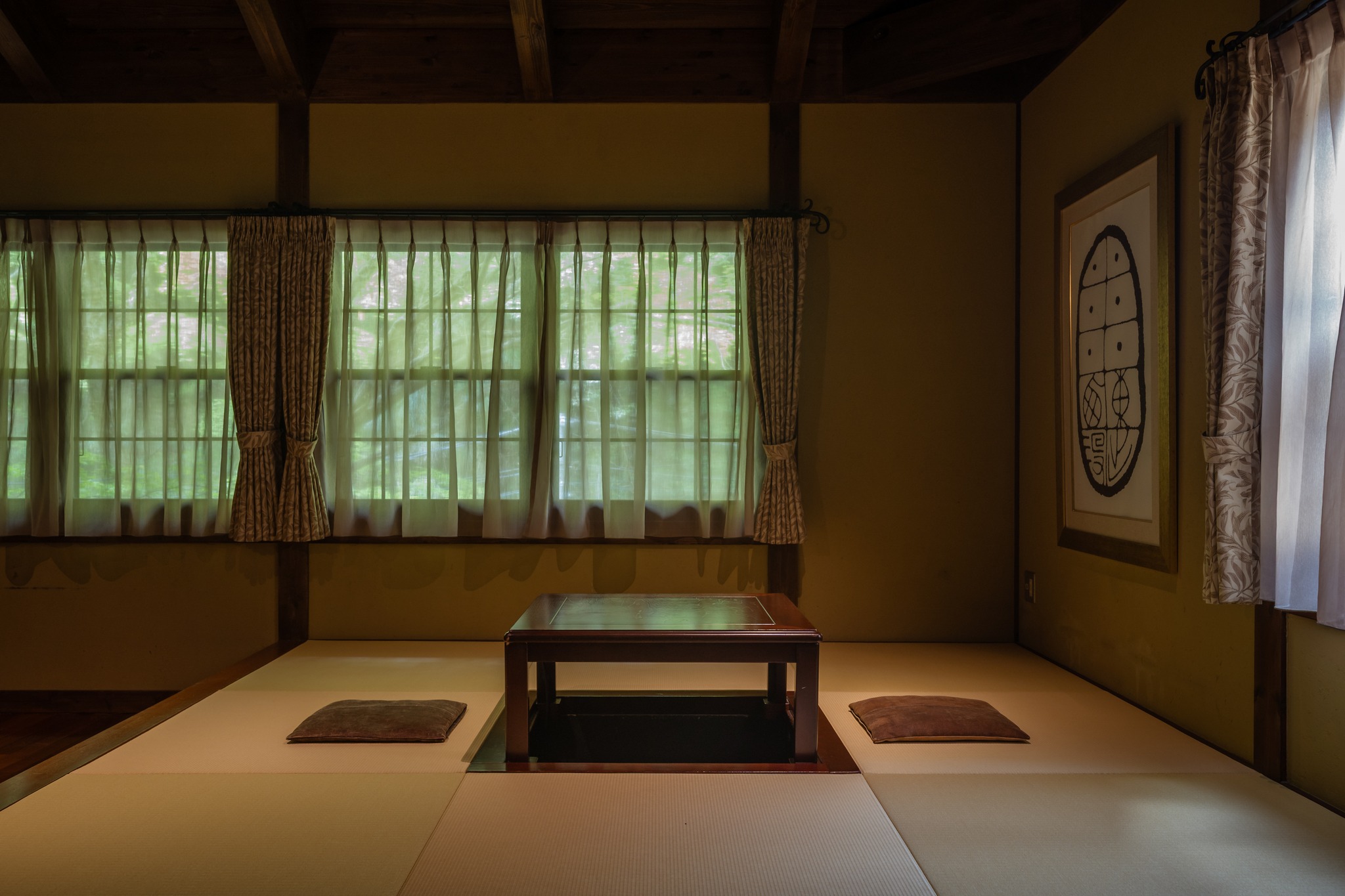 A luxury Japanese hotel boasting warmly lit interiors and traditional decor while being totally immersed in nature.